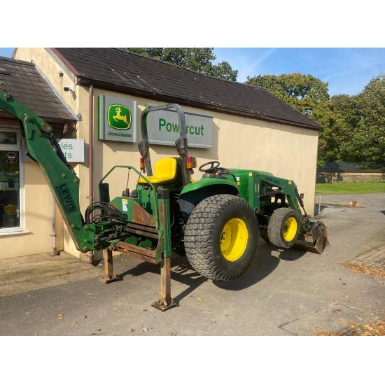 Used John Deere 4610 large chassis compact tractor with Lewis backhoe and front loader